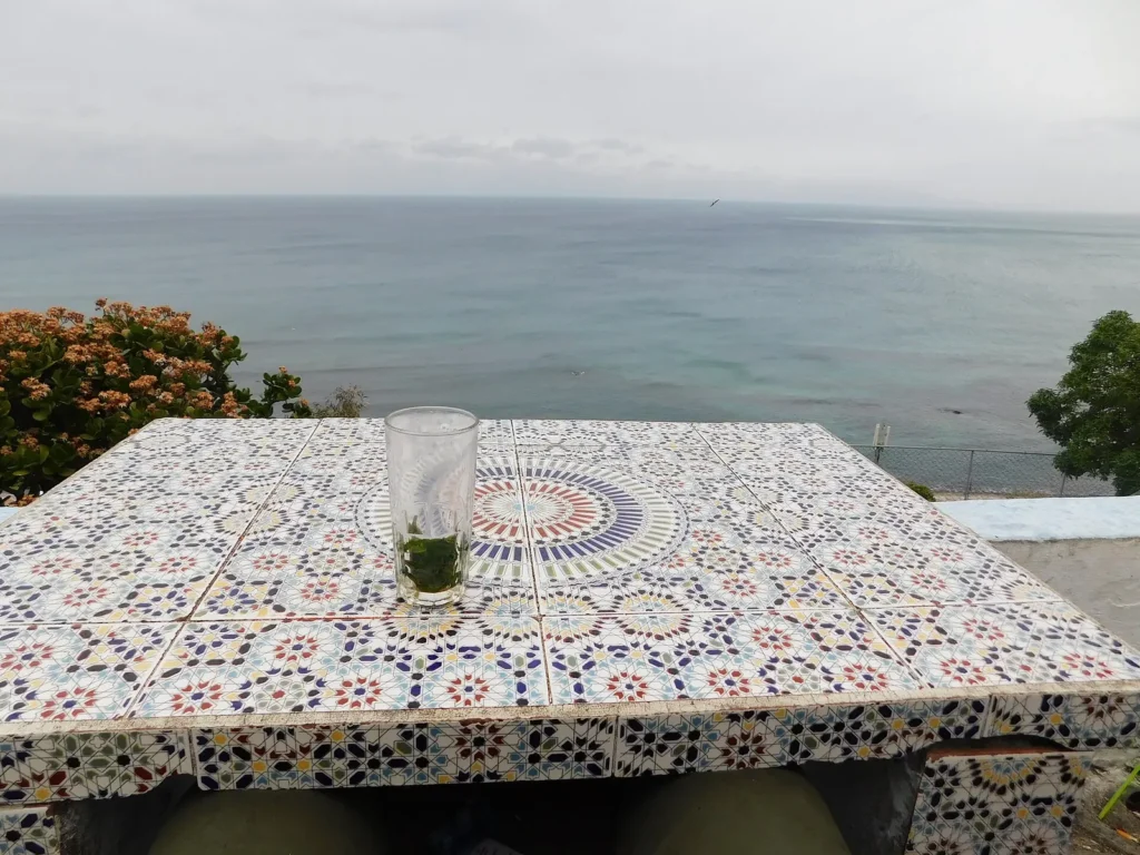 Mint tea on a tiled table at Café Hafa, a must for one day in Tangier